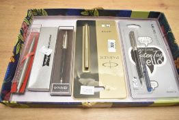Five ballpoint, rollerball and fountain pens. A Parker Jotter rollerball still sealed in packet, a
