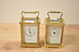 A late 20th-century Mappin and Webb brass carriage clock with a deocrative handle, having a white