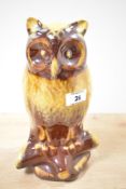 A vintage Canadian Blue Mountain Pottery perched owl, featuring a drip-glaze harvest gold