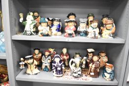A collection of 24 late 20th-century Roy Kirkham Pottery Toby Jugs, including Tinker, Tailor,