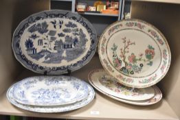 A selection of six large oval ceramic serving plates, to include examples from Doulton Burslem,