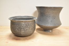 An antique Omani turned copper vessel, of traditional decorative design, sold together with a