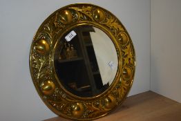 A 20th-century Keswick School of Industrial Arts (KSIA) Arts and Crafts brass wall mirror, featuring