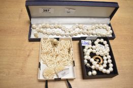 A collection of cultured pearl necklaces, comprising a single row of large cultured pearls of non-