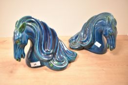 A pair of vintage Italian glazed ceramic horse heads in the style of Aldo Londi for Bitossi,