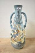 An attractive C.H. Brannam Barnstable Arts and Crafts vase, featuring a tall, tapered conical