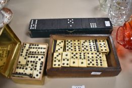 Three boxes of 20th-century playing dominoes, to include a Goodwins 'Double Nine' set (3), some