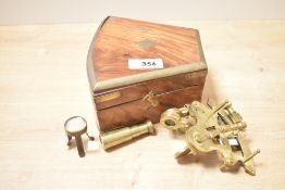 A 1910 Troughton and Simms of London brass sextant, number 1230, a navigational instrument used