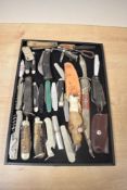 A selection of 20th-century pen knives, multi-tools, and pocket knives, to include horn-handled,