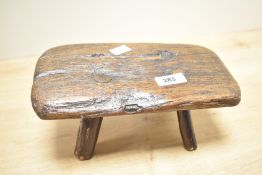 A 19th-century hand crafted oak miniature rectangular stool with four legs, 24.5cm, exhibiting a