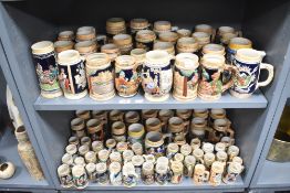 A large collection of 20th-century stoneware beer steins, from a variety of locations, to include