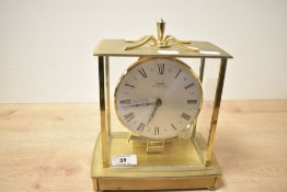 A late 20th-century Kundo Electronic brass case mantel clock, 20.5cm.