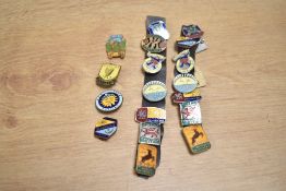 A collection of mid-20th-century Butlins pin badges, from locations such as Margate (1961), Ayr (