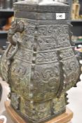 An interesting Chinese cast-bronze vessel of archaic design, having patinated finish, later