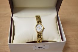 A boxed Rotary wristwatch, the small white dial having Roman numerals, on a gold tone bracelet