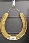 A brass horse shoe having impressed mark for Mr Geo, Stevens Decoration Committee 8, March 1877,