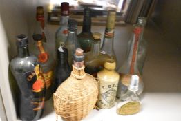 A collection of fourteen 20th-century bottles, including, for example, Jonas Alexander & Sons of