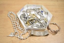 An assortment of costume jewellery, including statement pieces, neck chains and clip on earrings
