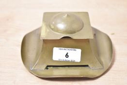 A Keswick School of Industrial Arts (KSIA) Arts & Crafts brass inkwell, of geometric form, with a