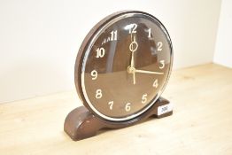 A 20th-century oak mantel clock, converted to quartz, 20cm, with signs of wear to the base.