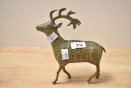A mid 20th-century cast brass red deer, of Persian style, featuring a highly decorative