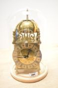 A 20th-century Smiths Lantern Clock, converted to quartz, featuring brass fish and floral