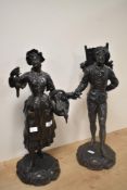 A pair of French bronzed spelter statues, featuring a female titled Marchande de Volailles (