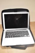 A 2013 Apple Macbook Air, Model A1466 in silver colourway, 13 inch, to include a Thule laptop case
