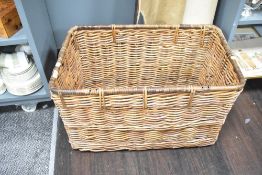 A large 20th-century woven willow wicker basket, of deep rectangular form with two handles, 75.5cm.