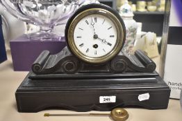 An early 20th-century French slate 8-day mantel clock, with Roman numerals framed by a brass