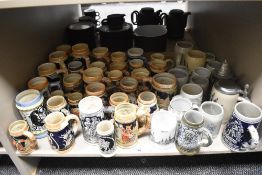 A large collection of 20th-century beer steins, in a variety of decorative styles and locations,