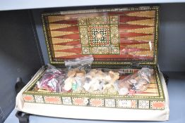 A 20th-century Middle Eastern-style wooden box for chess and backgammon, featuring very decorative