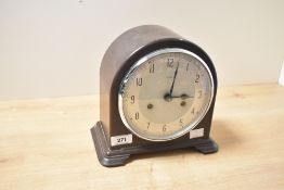 A 20th-century Enfield 8 day Bakelite cased strike mantelclock, having Arabic hours, 20.5cm high.