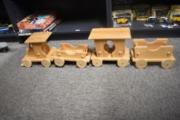 Modern Wooden Pull along Train, Engine with carriage and two open wagons, length 10cm