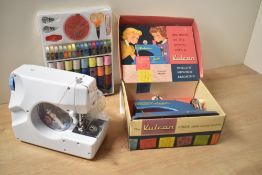 Vulcan Junior Child's Sewing Machine in original box along with a small Sewing Machine model