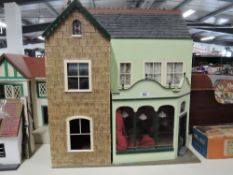 Modern Two Storey Dolls House in the Victorian style, part fitted with fires and stoves etc,