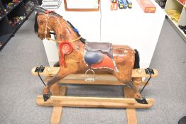 Modern Wooden Rocking Horse having real horse hair mane and tail, real leather saddle with