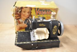 Vulcan Childs Sewing Machine with needle, cotton and clamp envelope present in original box, box