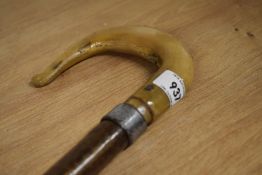 A Hazel shafted walking stick with a bone handled crook and a rubber ferrule to base measuring 110cm