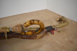 A selection of four walking sticks / baton of varying lengths