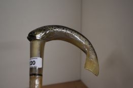 A walking stick measuring 120cm long the crook shaped head being a carved fish and decorated in