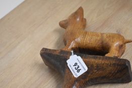 A walking stick with a carved dog in wood measuring 107cm long