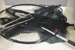 A selection of 4 landing nets of varying sizes