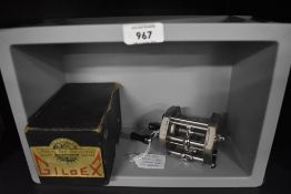 A Gildex level wind casting and spinning reel with original box and instructions in unused