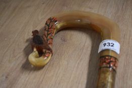 A Hazel walking stick with carved crook handle carved into a grouse with heather decoration