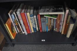 A shelf of approximately 30 gun and shooting related books