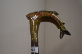 A wooden walking stick with a fish carved into the handle brass ferrule to top and bottom