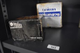 Two vintage fly fishing reels in their original boxes A Daiwa 275 mooching reel with instructions