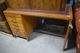 An early to mid 20th Century golden oak desk having fixed top with drawers to left hand side , width