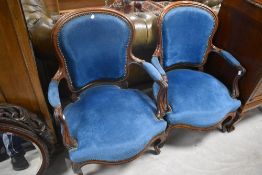 A pair of 20th century French style armchairs with serpentine fronted and sprung seats, part